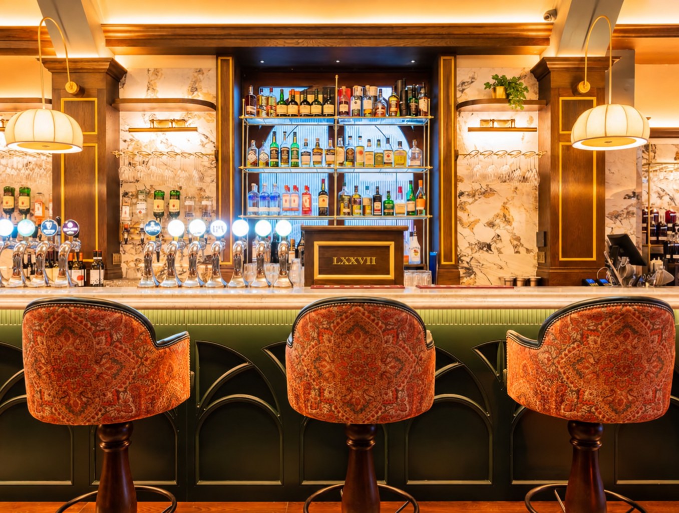 Warm bar interior with upholstered stools