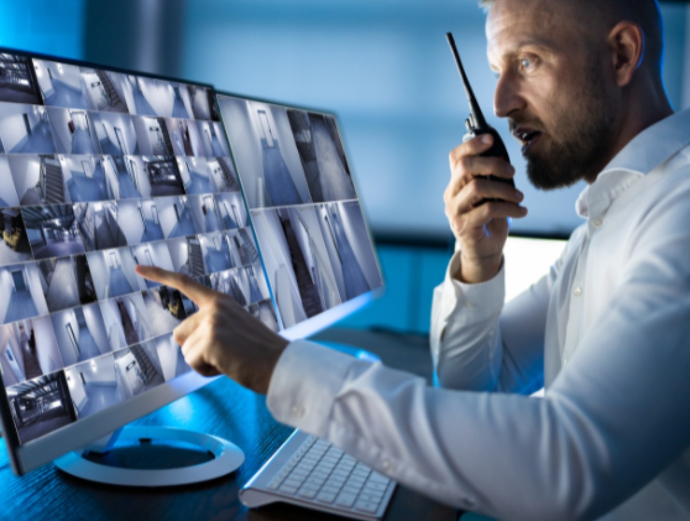Security professional monitoring CCTV screens